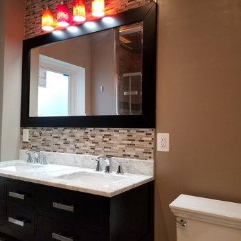 B H I Construction - a bathroom with a toilet and sink - General Contractors Near Me - Beltsville, Maryland B H I Construction - a bathroom with a toilet and sink - General Contractors Near Me - Beltsville, Maryland