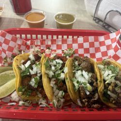 Pastor, steak, and chicharron tacos
