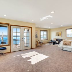 Jenny Wetzel - Windermere Abode - 2223 Day Island Blvd W, University Place, WA 98446. Primary Suite featuring private balcony with West facing views of the Puget Sound.