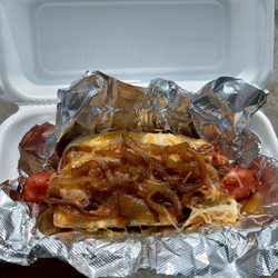 Get It On A Bun At Booty's - angus beef hotdog with their award winning chili, shredded cheese and grilled onions