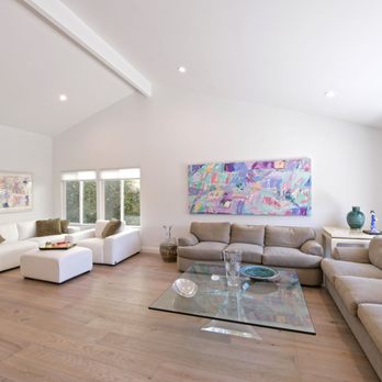 Cisco Construction - a living room with a couch and a coffee table - General Contractors Near Me - Tarzana, California