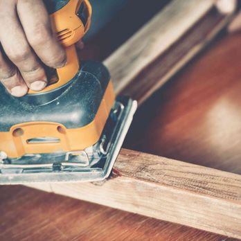 Fenelon Handyman Services - a person sanding a piece of wood - Handyman Near Me Fenelon Handyman Services - a person sanding a piece of wood - Handyman Near Me