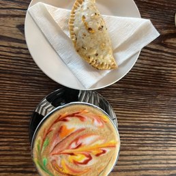 Lavender rainbow latte and a beef empanada Lavender rainbow latte and a beef empanada
