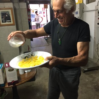 The International Kitchen - Visiting a very old family olive oil mill and having dessert...sliced oranges with olive oil and a little sugar! - Travel Services Near Me - Chicago, Illinois