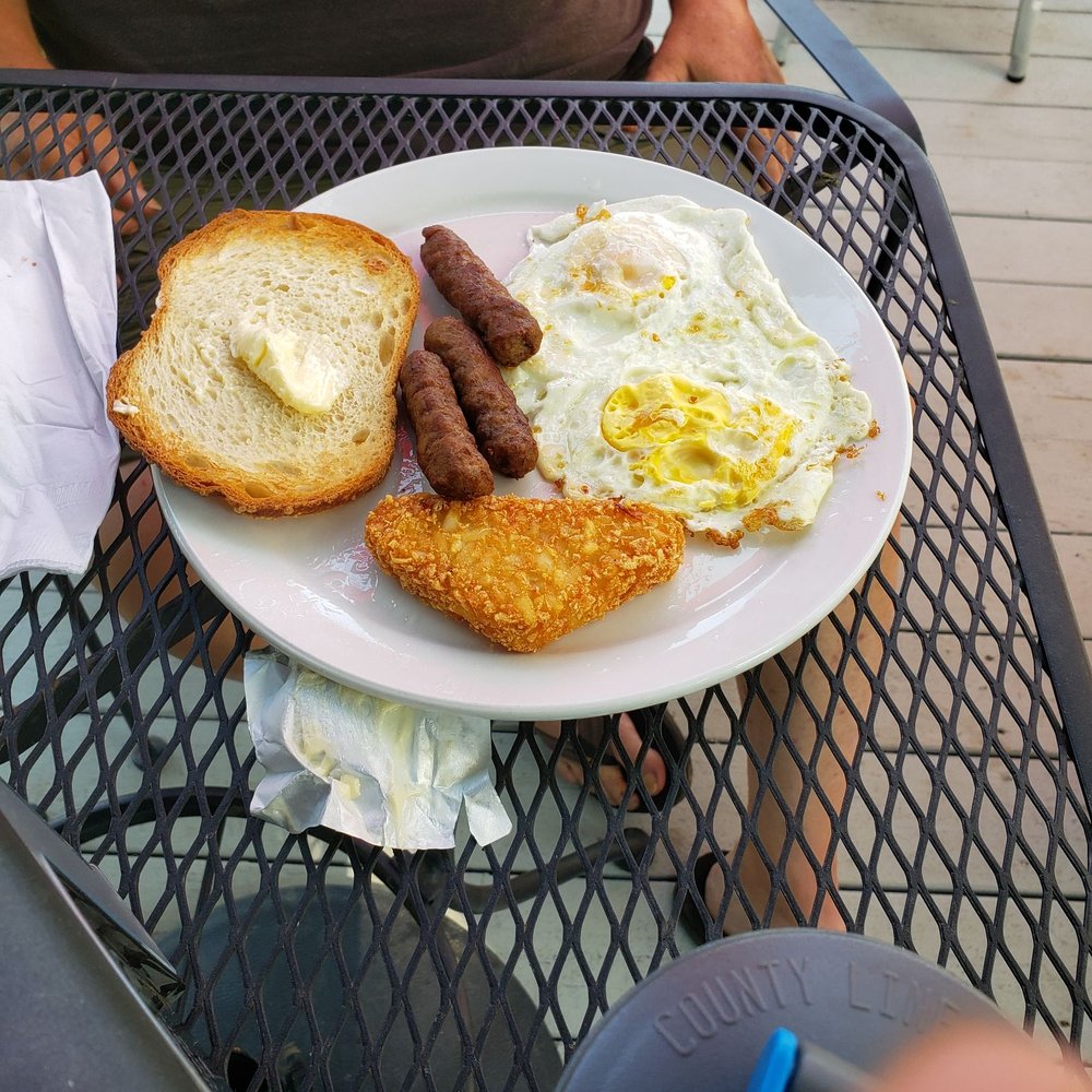 Ko-Ket Resort - My husband's $15 Sunrise Breakfast--2 old eggs, 1 small piece of toast, 3 sausages, and 1 deep fried potato triangle - Hotels Near Me - Isleton, California Ko-Ket Resort - My husband's $15 Sunrise Breakfast--2 old eggs, 1 small piece of toast, 3 sausages, and 1 deep fried potato triangle - Hotels Near Me - Isleton, California