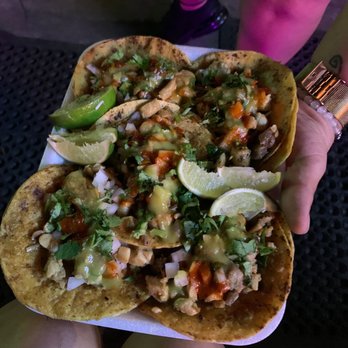 Cyn-Sational Tacos - a person holding a plate of food - Tacos Near Me Cyn-Sational Tacos - a person holding a plate of food - Tacos Near Me