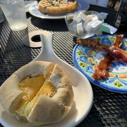 Muskrat Alley Cafe - Veggie Rock Bialy, side of Bacon and Joe Blue (Blueberry Waffle)