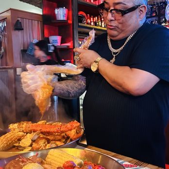 Surfing Crab - The owner serving us - Seafood Near Me - Escondido, California Surfing Crab - The owner serving us - Seafood Near Me - Escondido, California