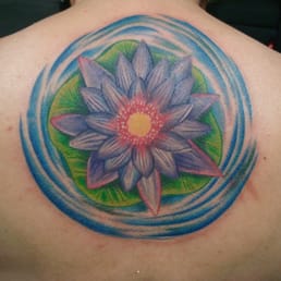 Lotus with lily pad and ripples of water Lotus with lily pad and ripples of water