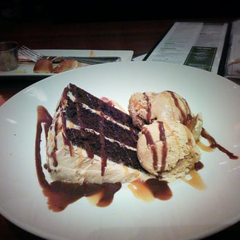 Houlihan's - Grande cappuccino cake. Chocolate cake, espresso icing, chocolate ganache, coffee ice cream, Kahlua fudge & caramel sauce. $6.95 - New American Near Me - Champaign, Illinois Houlihan's - Grande cappuccino cake. Chocolate cake, espresso icing, chocolate ganache, coffee ice cream, Kahlua fudge & caramel sauce. $6.95 - New American Near Me - Champaign, Illinois