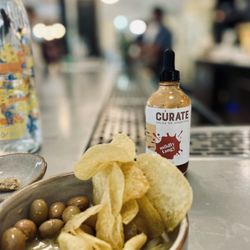 Events by Cúrate - Olives & complimentary chips with house made hot sauce