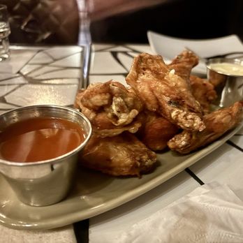 Oeste Bar & Cafe - Naked wings with a buffalo sauce - Burgers Near Me - Oakland, California Oeste Bar & Cafe - Naked wings with a buffalo sauce - Burgers Near Me - Oakland, California