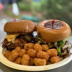 Macho Burgers - Classic bacon cheese on the left and a mushroom bacon Swiss on the right with tarot tots