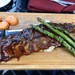 Ribs, mashed potatoes (under the ribs) maple glazed carrots and asparagus