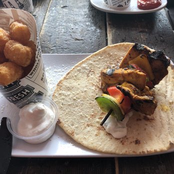 The Loaded Slate - Moroccan Chicken Kabob with delightful tator tots - Pubs Near Me - Milwaukee, Wisconsin
