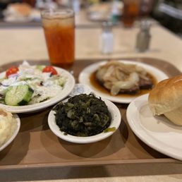 Roast beef w/onions, tossed salad, mashed potatoes and gravy, collard greens, sweet tea and a roll Roast beef w/onions, tossed salad, mashed potatoes and gravy, collard greens, sweet tea and a roll