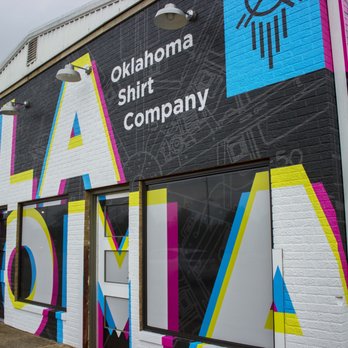 Lettering Express - Vinyl wall-wrap installation for Oklahoma Shirt Company. - Vehicle Wraps Near Me - Oklahoma City, Oklahoma Lettering Express - Vinyl wall-wrap installation for Oklahoma Shirt Company. - Vehicle Wraps Near Me - Oklahoma City, Oklahoma