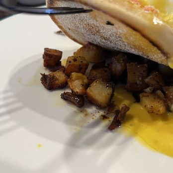 The Parlour - Under the King Crab Benny is potato surprise with bacon bits. - Breakfast & Brunch Near Me - Henderson, Nevada The Parlour - Under the King Crab Benny is potato surprise with bacon bits. - Breakfast & Brunch Near Me - Henderson, Nevada
