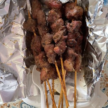 Z-One Kitchen - Lamb skewers - 8 in an order, plastic spoon for scale. - Chinese Near Me - San Bruno, California Z-One Kitchen - Lamb skewers - 8 in an order, plastic spoon for scale. - Chinese Near Me - San Bruno, California