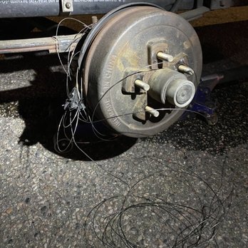 Big Al's Towing & Recovery - Tire wire wrapped around, and through the hub and brakes damaging the hub back plate and distorting the brakes - Towing Near Me - Cheyenne, Wyoming Big Al's Towing & Recovery - Tire wire wrapped around, and through the hub and brakes damaging the hub back plate and distorting the brakes - Towing Near Me - Cheyenne, Wyoming
