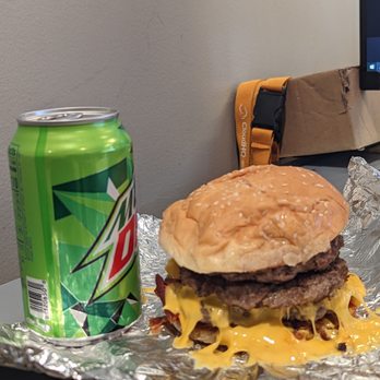 Five Guys - 3 patties, with cheese, bacon, tomato, grilled onions, mayo, ketchup, mustard, pickle. - Burgers Near Me - Manassas, Virginia Five Guys - 3 patties, with cheese, bacon, tomato, grilled onions, mayo, ketchup, mustard, pickle. - Burgers Near Me - Manassas, Virginia