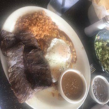 Uncle Julio's - Enchiladas nortenos add carne asada. 3 cheese and onion enchilada topped with two fried eggs, rice and beans. My favorite thing here. - Mexican Near Me - Gaithersburg, Maryland