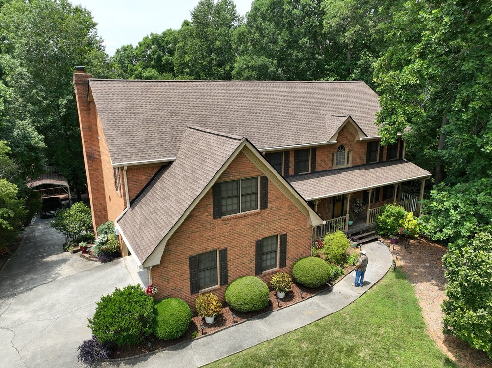 Slide of DOM Roofing & Restoration