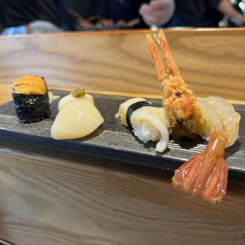 Sushi Kashiba - Shellfish spread right to left: shrimp, geoduck, scallop, sea urchin - Japanese Near Me - Seattle, Washington Sushi Kashiba - Shellfish spread right to left: shrimp, geoduck, scallop, sea urchin - Japanese Near Me - Seattle, Washington