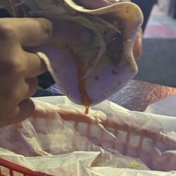 The Munch Bar - Taco full of grease dripping out.