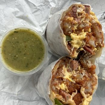 LJ’s Lil’ Cafe - Spicy OG (3 eggs, tater tots, hot Italian sausage, mixed cheese, grilled jalapeños, LJ's special sauce, Medium Green Serrano Salsa, $15.99) - Breakfast & Brunch Near Me - Cypress, California LJ’s Lil’ Cafe - Spicy OG (3 eggs, tater tots, hot Italian sausage, mixed cheese, grilled jalapeños, LJ's special sauce, Medium Green Serrano Salsa, $15.99) - Breakfast & Brunch Near Me - Cypress, California