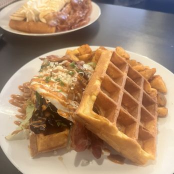 Jasper's Wafflato - belgian waffle served with mixed green,bacon, egg, goat cheese & drizzled with Chipotle mayo - Juice Bars & Smoothies Near Me - Jasper, Alberta