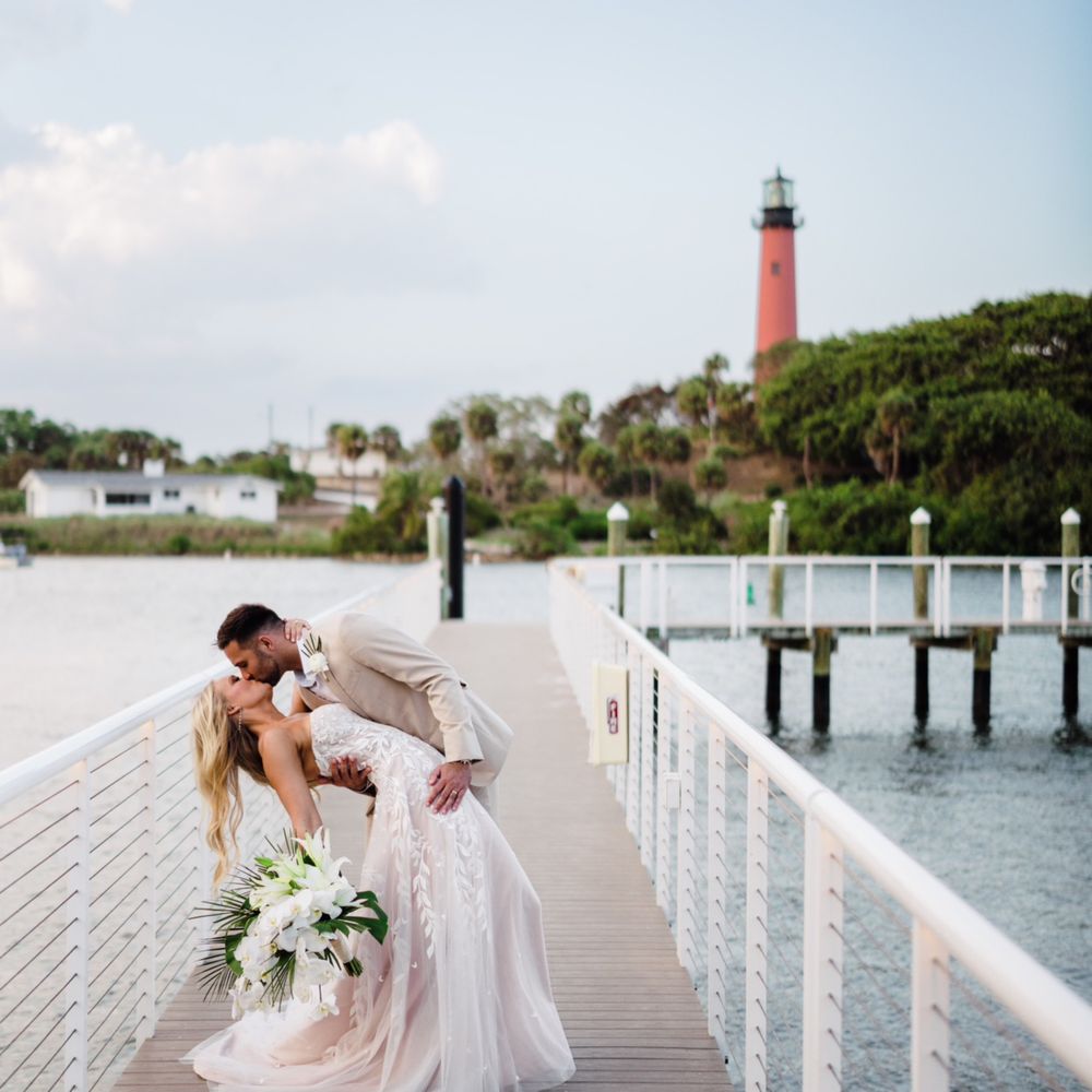 Pelican Club - Bride and groom on dock at Pelican club - Venues & Event Spaces Near Me - Jupiter, Florida Pelican Club - Bride and groom on dock at Pelican club - Venues & Event Spaces Near Me - Jupiter, Florida