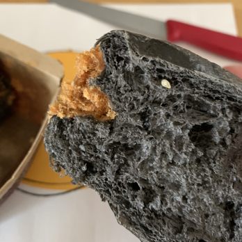7 Baker - a piece of bread with a bite taken out of it - Bakeries Near Me - Toronto, Ontario 7 Baker - a piece of bread with a bite taken out of it - Bakeries Near Me - Toronto, Ontario