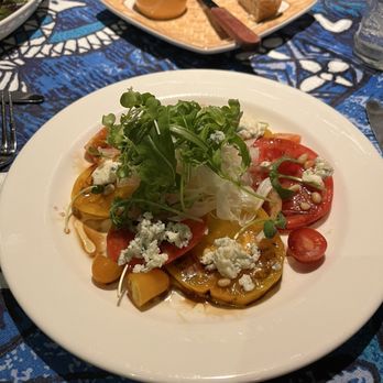 Mama's Fish House - Maui onion and tomato salad with blue cheese - Seafood Near Me - Paia, Hawaii Mama's Fish House - Maui onion and tomato salad with blue cheese - Seafood Near Me - Paia, Hawaii
