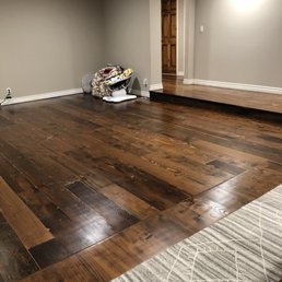 a hardwood floor in a living room a hardwood floor in a living room