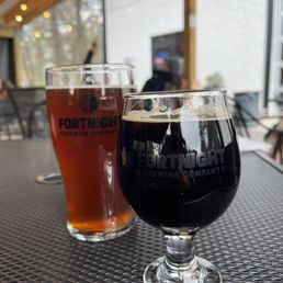 two glasses of beer on a table
