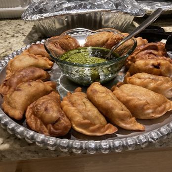 Papi’s Empanadas - My Friendsgiving contribution: chicken empanadas and chimichurri. I went home with an empty platter! - Empanadas Near Me