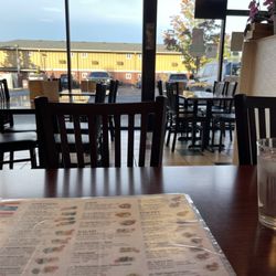 Inside view of Seven Thai looking out into their parking.