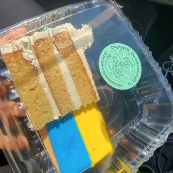 Captain Quack's Coffeehouse - Alice of vanilla bean cake and a cookie decorated like the Ukraine flag. Proceeds made from those cookies will be donated. - Bakeries Near Me - Austin, Texas Captain Quack's Coffeehouse - Alice of vanilla bean cake and a cookie decorated like the Ukraine flag. Proceeds made from those cookies will be donated. - Bakeries Near Me - Austin, Texas