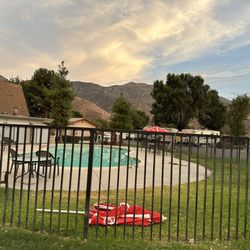 Banning Stagecoach KOA - Green cloudy pool, furniture and umbrellas strewn all around.