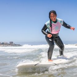 Surf Diva Surf School - Surfing beginner waves at Surf Diva