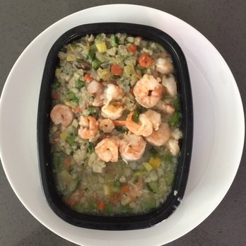 Caveman Chefs - The shrimp and vegetables together floating in water - Caterers Near Me