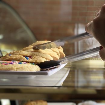 Sabor Criollo - a person cutting a cookie - Colombian Near Me - North Bergen, New Jersey Sabor Criollo - a person cutting a cookie - Colombian Near Me - North Bergen, New Jersey
