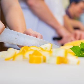 The Maine Meal - a person chopping vegetables on a cutting board - Food Delivery Services Near Me - Skowhegan, Maine The Maine Meal - a person chopping vegetables on a cutting board - Food Delivery Services Near Me - Skowhegan, Maine