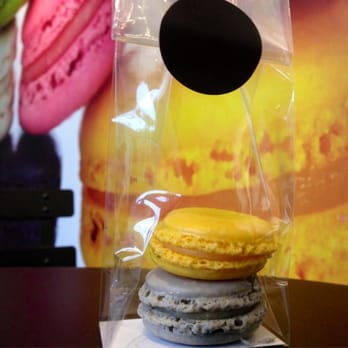Olivia Macaron - Lemon & lady gray macaroons, packaged in the shops standard to go bags - Macarons Near Me - Washington, DC, District of Columbia