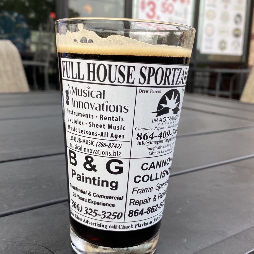 Full House Sportzaria - a glass of beer on a table - Pizza Near Me - Simpsonville, South Carolina