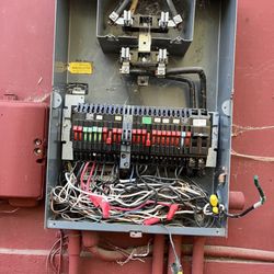 The Wire Wizard - The old mess of a panel we had Wire Wizard replace