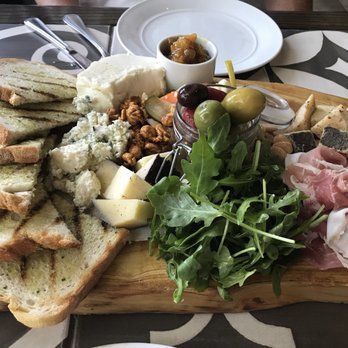 Grotto Downtown - Chef's selection cheeses, prosciutto, grilled bread, olives , almonds, caramel popcorn. Amazing! - Italian Near Me - Houston, Texas Grotto Downtown - Chef's selection cheeses, prosciutto, grilled bread, olives , almonds, caramel popcorn. Amazing! - Italian Near Me - Houston, Texas
