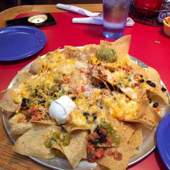 Salsa Brava - The nachos plain. I've had a lot a lot better..practically no topping and just a massive pile of tortilla chips. - Mexican Near Me - Flagstaff, Arizona