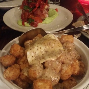Radiator Whiskey - Fried pork shank and tatar tots, gravy and fried egg - New American Near Me - Seattle, Washington